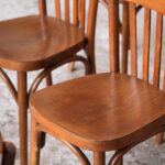 Lot de 8 chaises bistrot baumann en bois, dossier barreaux